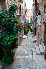 Fototapeta na wymiar One of the narrow side streets in Dubrovnik Old Town, Dalmatian Coast, Croatia