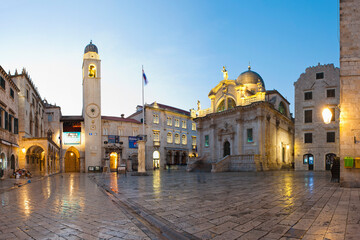 Photo of St Blaise Church and Dubrovnik City Bell Tower on Stradun, the main street in Dubrovnik Old Town at night, Dalmatia, Croatia
