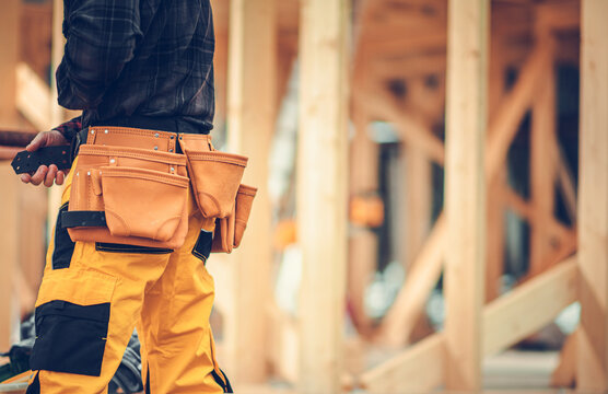 Residential Buildings Construction Worker with Tools Belt Close Up