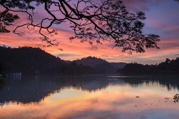 Dramatic sunrise at Kandy Lake and the Clouds Wall (Walakulu Wall), Kandy, Central Province, Sri Lanka, Asia