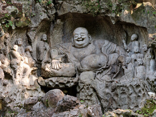 Fototapeta na wymiar Ancient Buddhist statues at Lingyin Temple in Hangzhou.