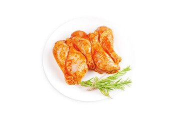 Baner.Cooking chicken drumsticks.Raw chicken legs in a marinade with rosemary on a background.Top view, copy space.Isolated.Marinated chicken dramstick with spices for cooking.
