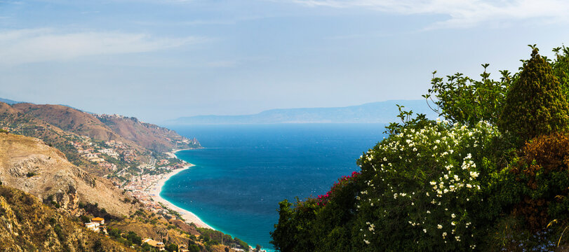 Panoramic photo of Letojanni Beach and Mazzeo Beach and the Ionian Sea (part of the Mediterranean Sea) seen from Taormina, East Coast of Sicily, Italy, Europe