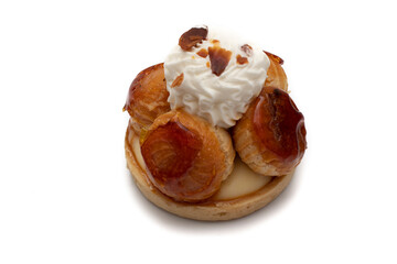 A delicious profiterole cake. Isolated on white background.