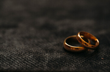 wedding rings on a black background