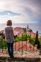 Tourist walking on Piran Town Walls, Slovenian Istria, Slovenia, Europe