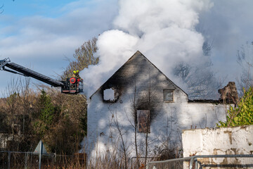 This is the Fire Brigade, SFRS, fighting fire that broke out within the unoccupied property at the...