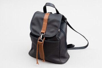 Naklejka premium Black leather backpack with zipper. school stationery