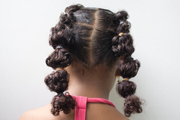 Little girl with blonde Boxer braids, African hair style also known as 