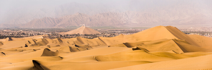 Fototapeta na wymiar Sand dunes in the desert at Huacachina, Ica Region, Peru, South America