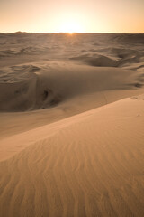 Fototapeta na wymiar Sand dunes in the desert at sunset, Huacachina, Ica Region, Peru, South America