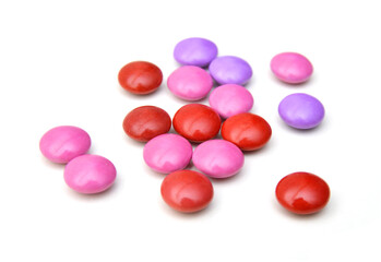 Closeup of colorful chocolate candies on white