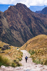Fototapeta na wymiar Hiking down from Dead Womans Pass 5,200m summit, Inca Trail Trek day 2, Cusco Region, Peru, South America