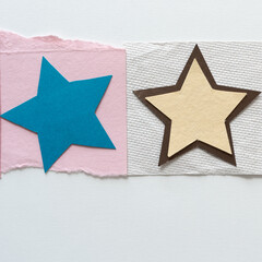 two paper stars on on paper with blank space