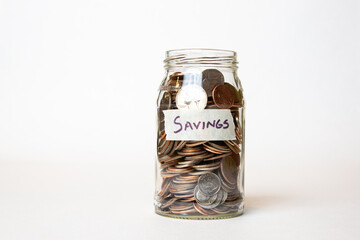 money in jar labeled savings 