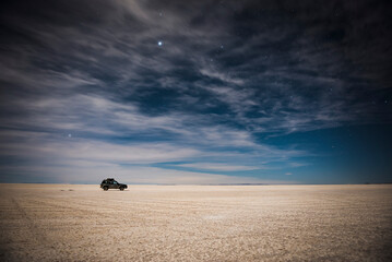 Night time driving on Uyuni Salt Flats (Salar de Uyuni), Uyuni, Bolivia, South America © Matthew