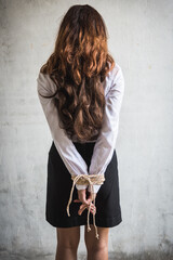 Detail kidnapped young female hands tied wrist with rope concept