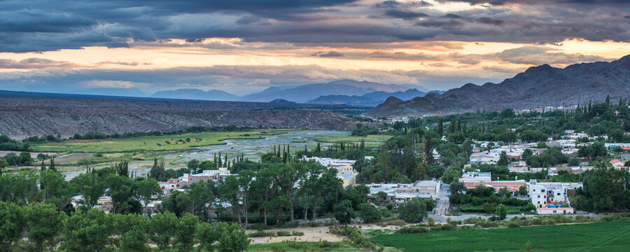 Cachi Town in the Andes Mountains landscape with dramatic sky at sunset, Cachi Valley, Calchaqui Valleys, Salta Province, North Argentina, South America