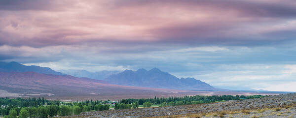 Andes Mountains landscape with dramatic clouds at sunset, Uspallata, Mendoza Province, Argentina, South America, background with copy space