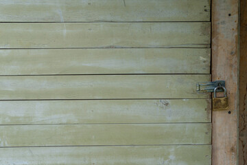 Rustic wooden background. Closed old door.
