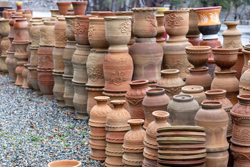 Flower pots stacked in a market for sale