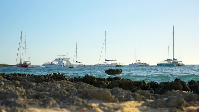 Motor boats and yachts with tourists are returned to the port from the excursions. Bayahibe, Dominican Republic