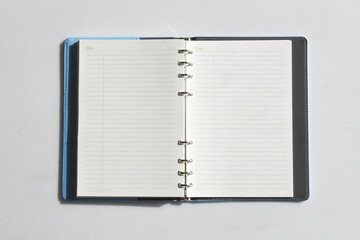 Open diary, planner or notebook. Office and business supplies for lists, reminders, schedules or agendas.