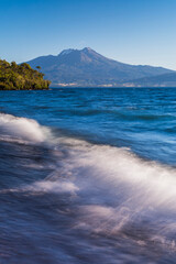 Calbuco Volcano at sunset, seen from a beach on Llanquihue Lake, Chilean Lake District, Chile, South America