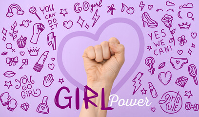 Hand of woman with clenched fist and text GIRL POWER on color background. International Women's Day...