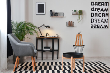 Stylish interior of minimalist room with modern workplace