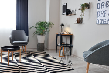 Stylish interior of minimalist room with modern workplace