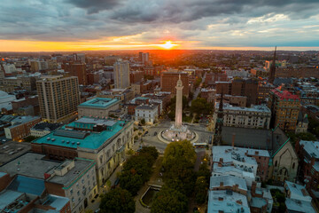 Aerial Drone View of Washington Monument in Baltimore City at Sunset on a Cloudy day