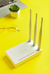 White wi-fi router on color background