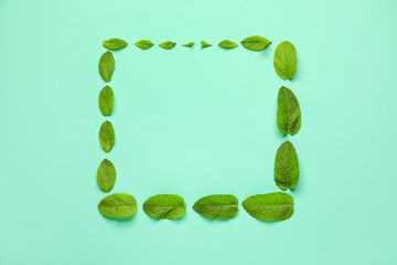 Frame made of fresh mint leaves on color background © Pixel-Shot