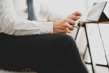 Businessman doing finances and calculate about cost, Business Financing Accounting Banking Concept