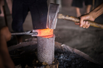 Metal workers at a blacksmiths, Inle Lake, Shan State, Myanmar (Burma)