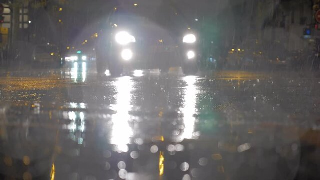 Cars driving under the rain at night