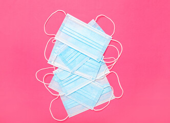 Surgical masks on color background