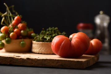 Fresh tomato on black background. Organic vegetable from Thai farmer in local market