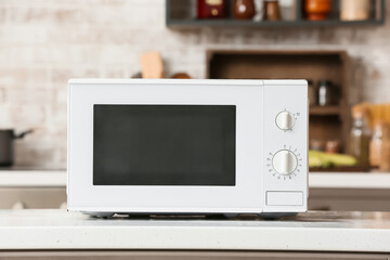 Modern microwave oven on counter in kitchen
