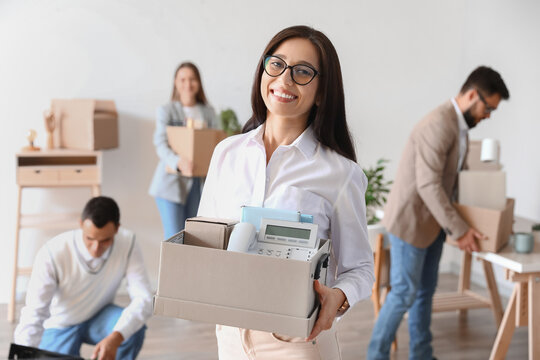 Beautiful Woman Holding Box With Personal Things In Office On Moving Day