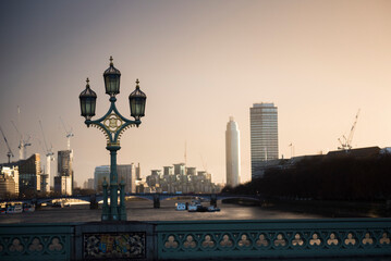 Westminster Bridge Lamp at sunset, with River Thames and Vauxhall behind, London, England