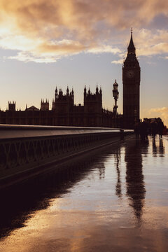 Houses of Parliament (Palace of Westminster) and Big Ben silhouetted at sunset, seen from Westminster Bridge, London, England