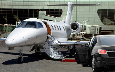 Private jet waiting for passenger with black limo in airport - obrazy, fototapety, plakaty
