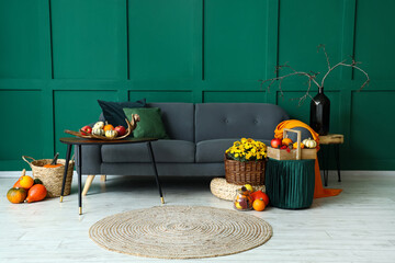 Interior of beautiful living room with sofa and autumn decor