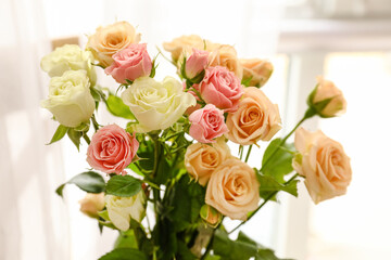 Closeup view of beautiful roses in light room