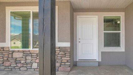 Panorama Front door exterior of a house with gray and white color palette