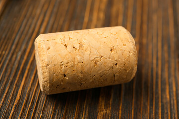 Wine cork on wooden background, closeup