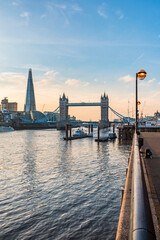 Fototapeta premium Tower Bridge and the Shard at sunset, seen behind the River Thames, Tower Hamlets, London, England