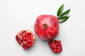 Ripe delicious pomegranate on light background